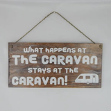 Sign "What Happens in the Caravan"
